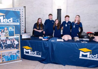 MedEd students and program representatives engage with visitors at the West Virginia State Capitol, demonstrating hands-on clinical skills and sharing how the program prepares high school students for in-demand healthcare careers.